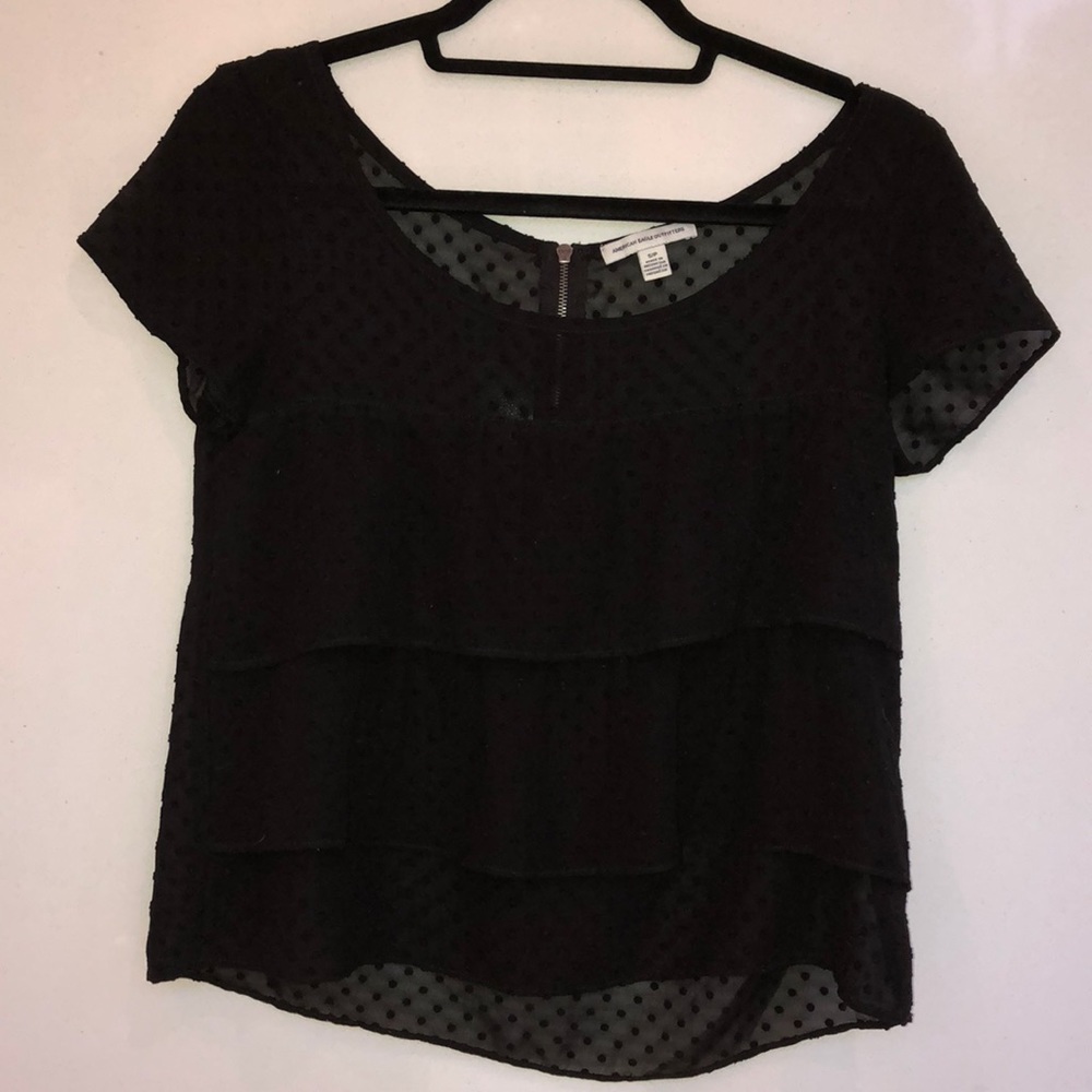 Translucent black polka doted shirt